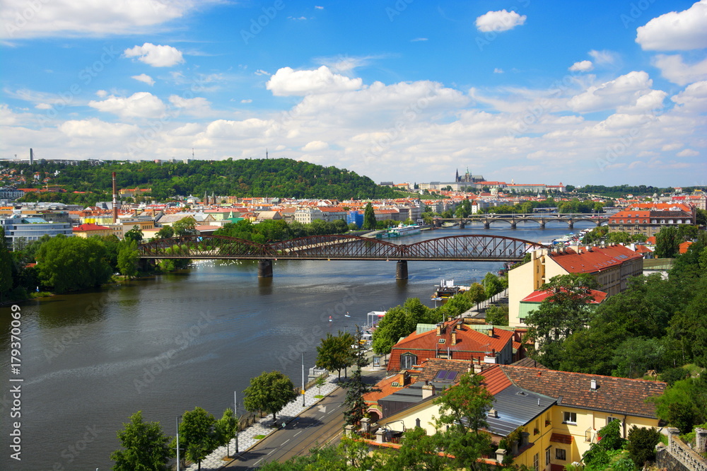Prague Viewn on Vltava river and old railway bridge.