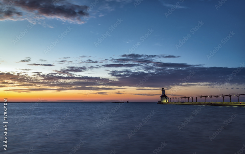 Obraz premium Lighthouse at sunset sky on Lake Michigan, Indiana, USA