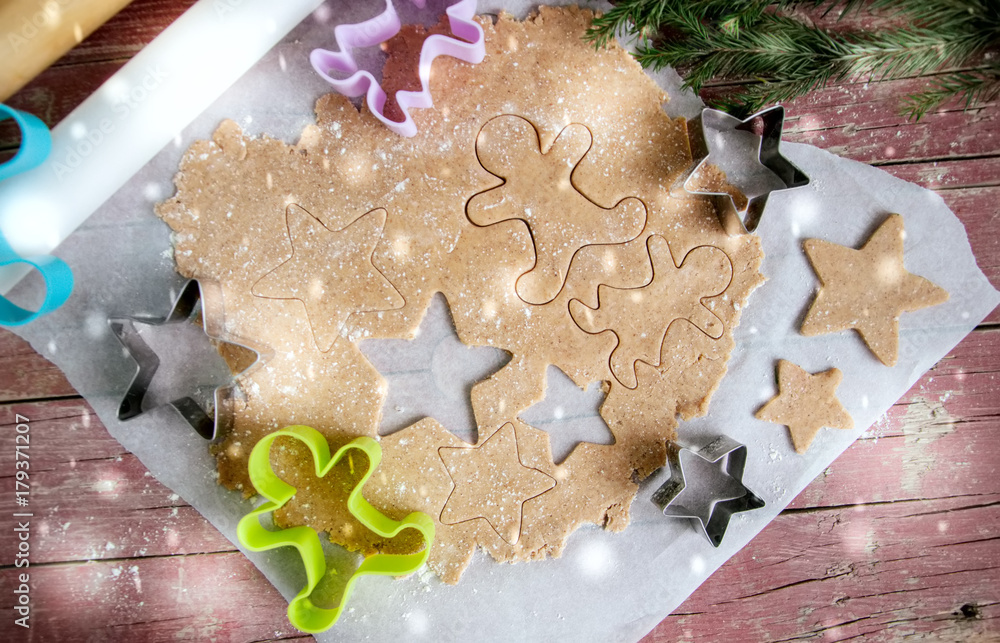 Gingerbread batter (dough) with cookie cutters Gingerbread batter (dough) with cookie cutters