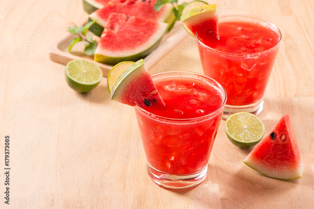 Watermelon drink in glasses with slices of watermelon in summertime Watermelon drink in glasses with slices of watermelon in summertime