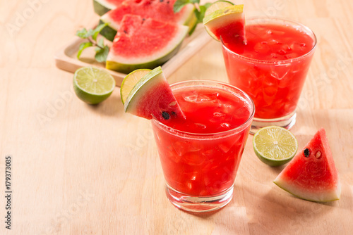 Watermelon drink in glasses with slices of watermelon in summertime