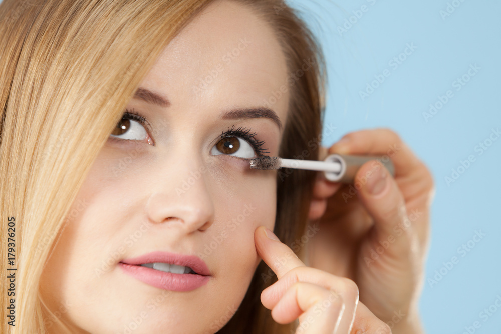 Woman getting make up done by artist