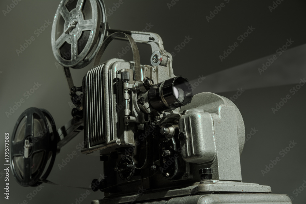 Old cinema projector on a dark background Old cinema projector on a dark background