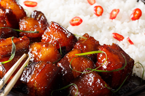 Vietnamese food: caramelized pork belly with rice macro. horizontal background photo