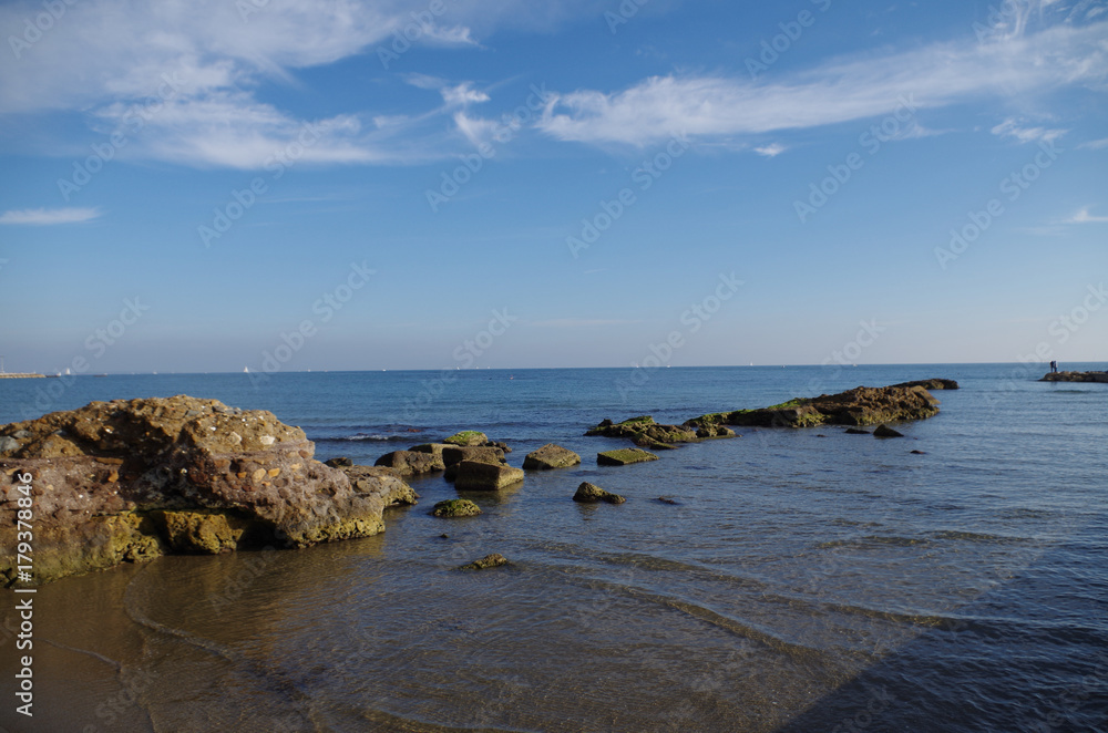 rocks in the sea in crystalline water;