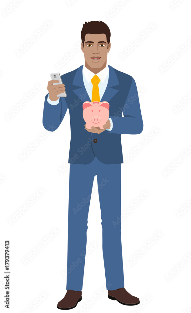 Businessman with mobile phone and piggy bank