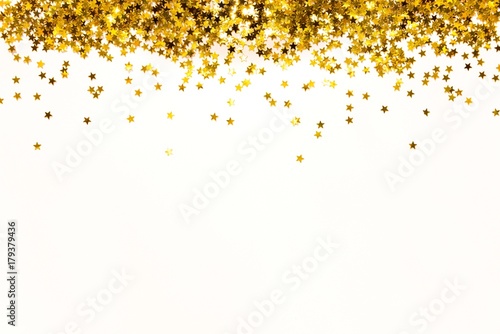 Star shaped golden sequins background. Copy space.