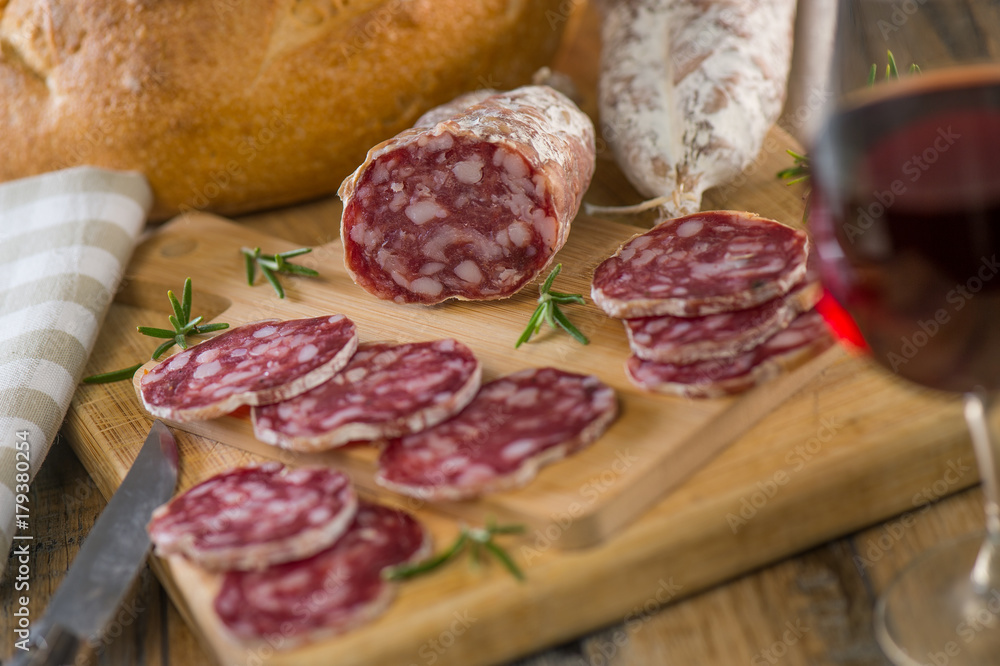 French salami Sausage on a wooden table