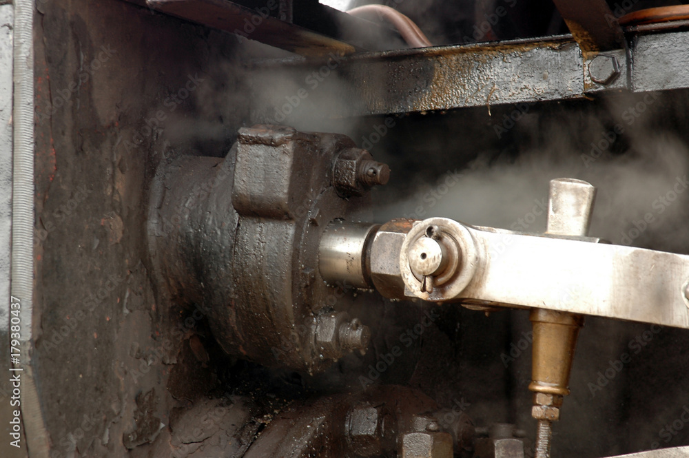 Closeup on part of a steam locomotive.