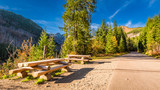 Sunny day in the Tatras mountains at autumn with bench