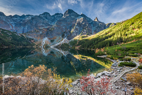 Cold sunrise at lake in the Tatra Mountains in autumn