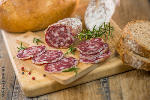 French salami Sausage on a wooden table