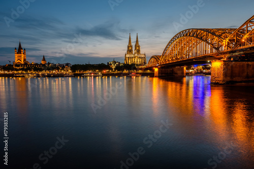 Cologne Cathedral and Hohenzollern Bridge at night, Germany © haveseen