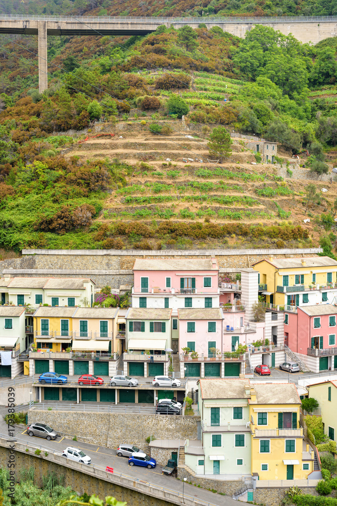 View to city buildings and mountains in a foggy day. Riomaggiore, Italy View to city buildings and mountains in a foggy day. Riomaggiore, Italy