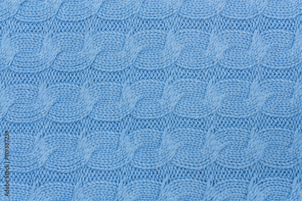 Texture of blue knitted woolen fabric for background