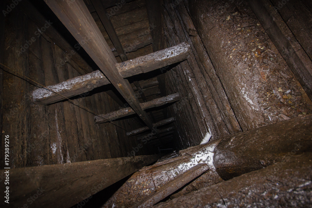 Deep underground wooden mine shaft Deep underground wooden mine shaft