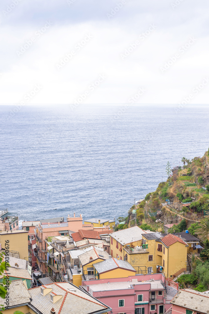 Beautiful view to Manarola mountains, city and a part of sea