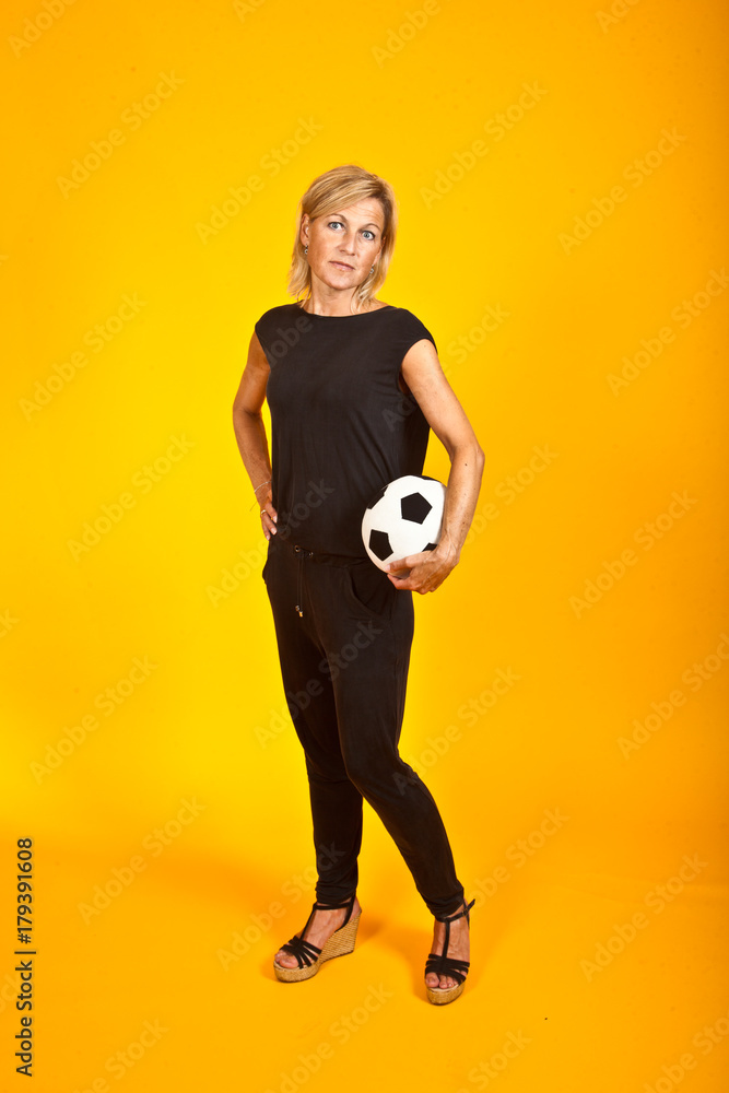 woman posing with a soccer ball woman posing with a soccer ball