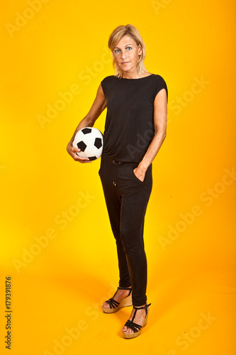 woman posing with a soccer ball