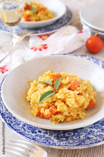 Pumpkin risotto and glass of white wine