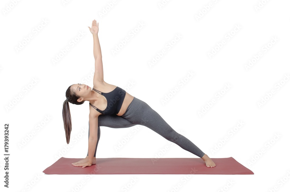 young asian woman doing yoga in Utthita Parsvakonasana or Extended Side Angle Pose yoga pose on the mat isolated on white background, exercise fitness, sport training and healthy lifestyle concept young asian woman doing yoga in Utthita Parsvakonasana or Extended Side Angle Pose yoga pose on the mat isolated on white background, exercise fitness, sport training and healthy lifestyle concept
