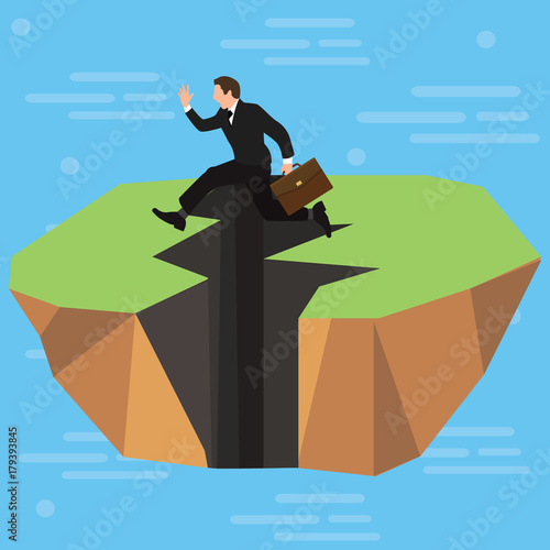 A businessman high-jumps over a long jagged earthquake rift in the ground. Business and competitions. Personal growth. Overcome difficulties.