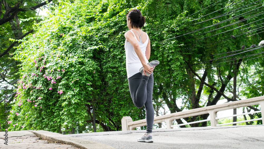 sport woman stretching running in street park city urban background beautiful garden sport woman stretching running in street park city urban background beautiful garden