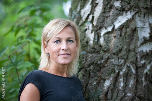 Portrait of a cute blond scandinavian woman shot outdoor