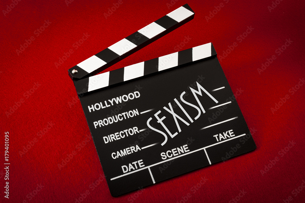 Sexism and sexual harassment in hollywood concept with clapper board representing the movie industry and the text Sexism