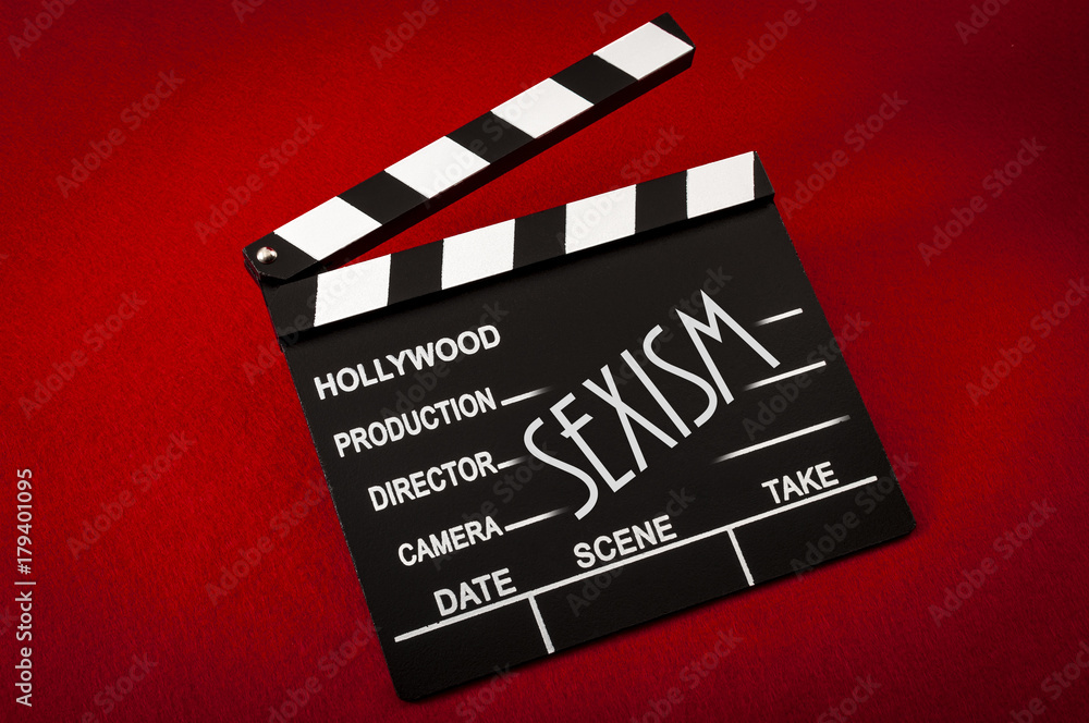 Naklejka premium Sexism and sexual harassment in hollywood concept with clapper board representing the movie industry and the text Sexism