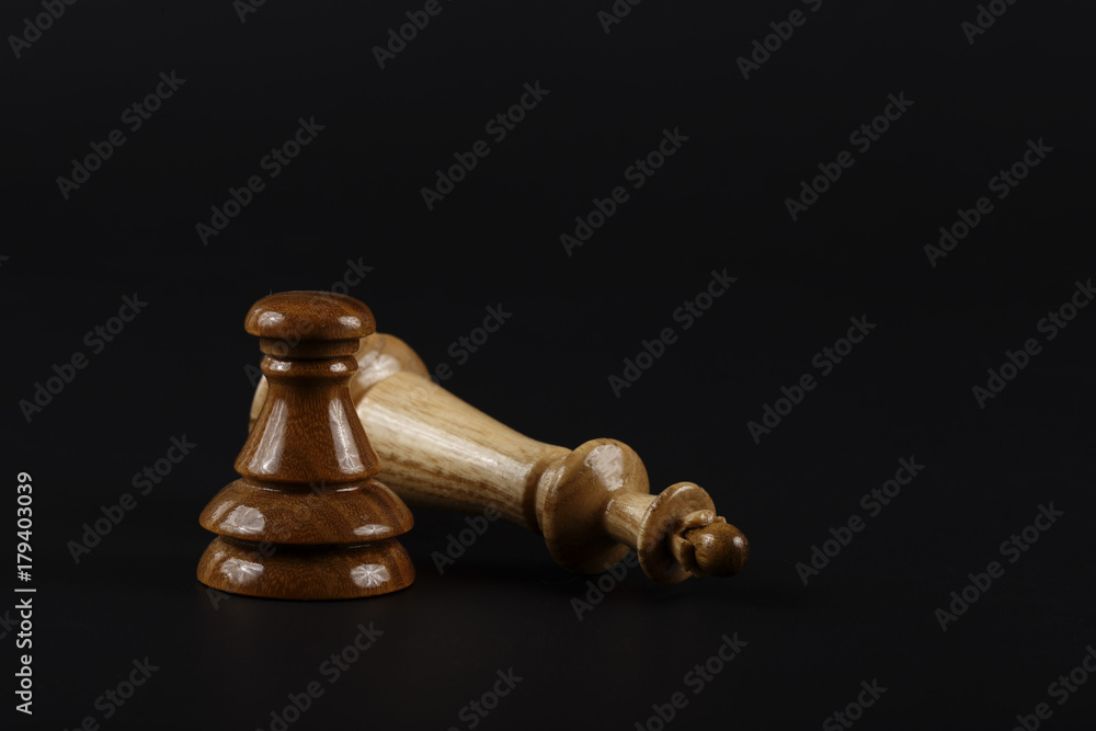 Two chess pieces on a dark background Two chess pieces on a dark background