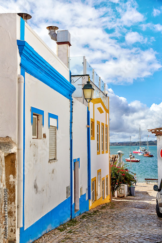 Beautiful narrow street of Alvor, Portugal photo