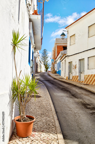 Beautiful narrow street of Alvor, Portugal photo