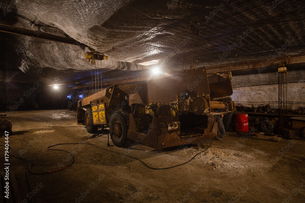 Underground mine shaft iron ore tunnel gallery with machine transport