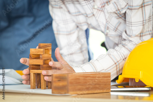 Photograph of engineer make the mock up wood brick close up.