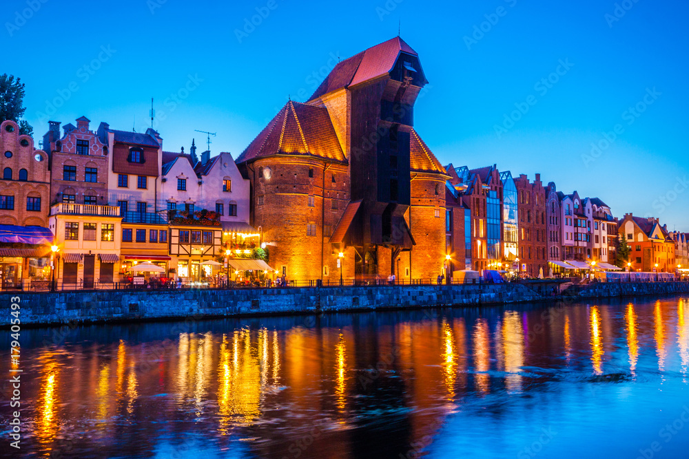 Gdansk at night with reflection in Motlawa river, Poland