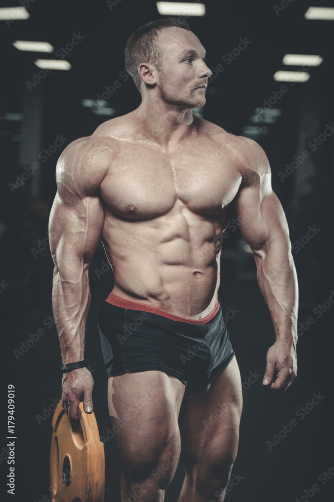 Brutal Caucasian bodybuilder working out in gym Brutal Caucasian bodybuilder working out in gym