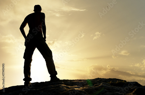 Silhouette of man in mountain.