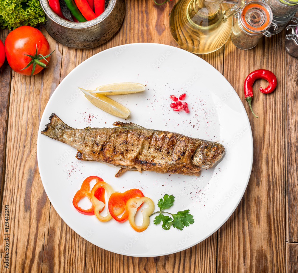 Fish dish - fried fillet with vegetables Fish dish - fried fillet with vegetables