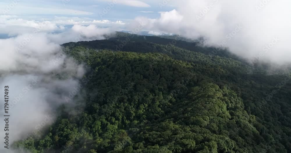 Aerial View. Flying over the beautiful mountain in clouds. Aerial View. Flying over the beautiful mountain in clouds.