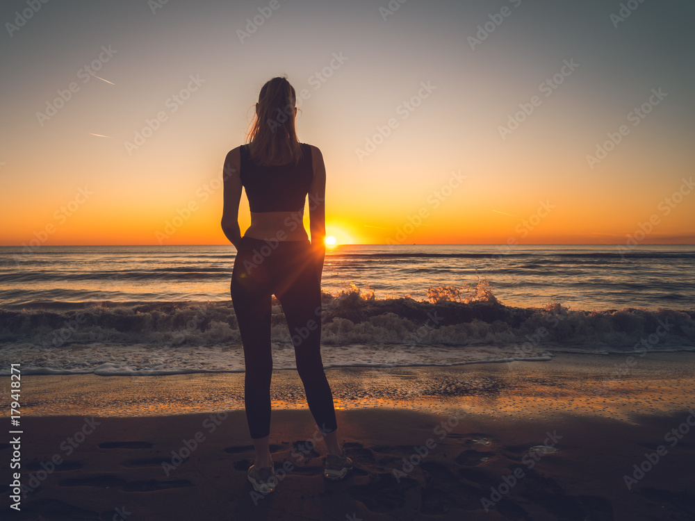 girl on the sea during sunset. Fitness and healthy lifestyle girl on the sea during sunset. Fitness and healthy lifestyle