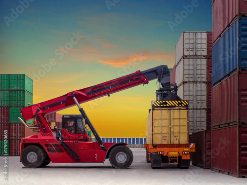Photography Reach stacker is working at container depot service, Reach stacker lift off container from truck