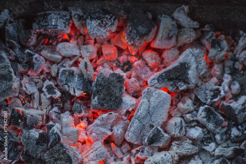 red-hot pieces of coal and the flames in the brazier for cooking food