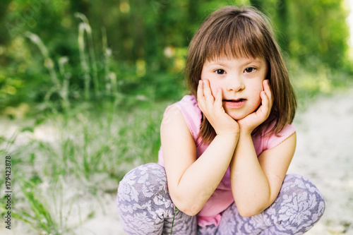Portrait of young girl with down syndrome © NDABCREATIVITY