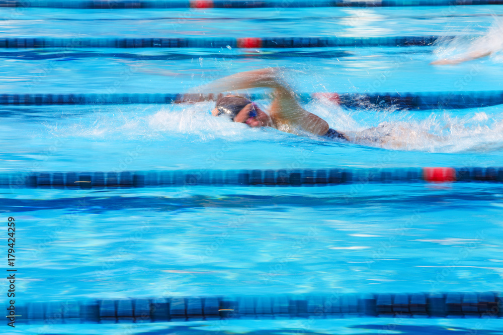 Freestyle swimmer motion blurred image