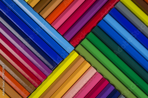 Abstract pattern of wooden coloured pencils