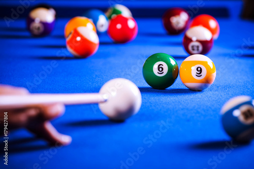 billiard balls in a blue pool table
