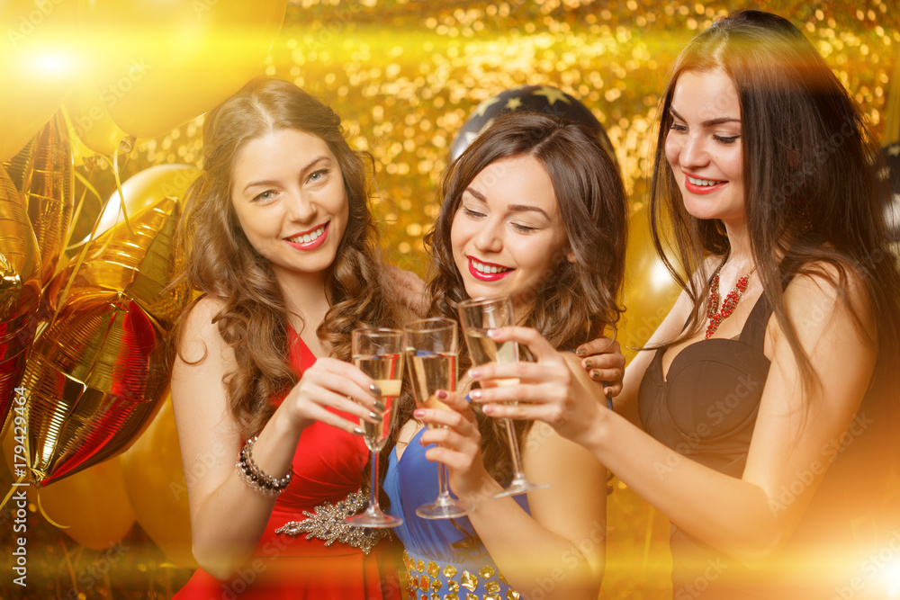 Party girls dancing in club. Women celebrate a holiday, a birthday or a new year. Party girls dancing in club. Women celebrate a holiday, a birthday or a new year.