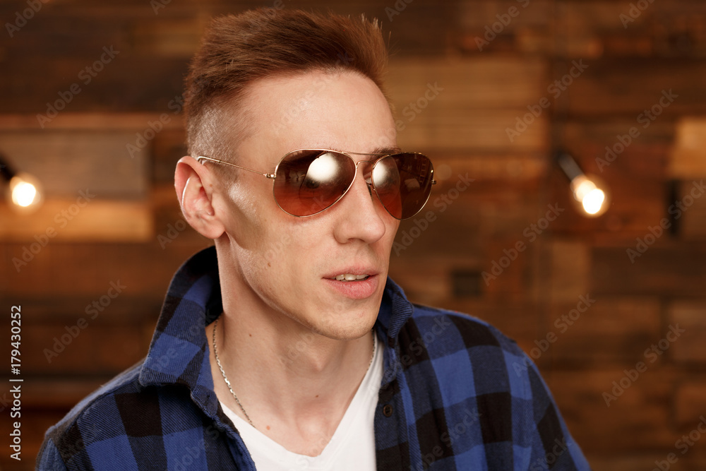 Portrait of a man on a wooden background Portrait of a man on a wooden background
