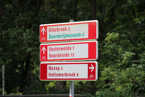 Direction signs in white and red dor cyclist in the Netherlands